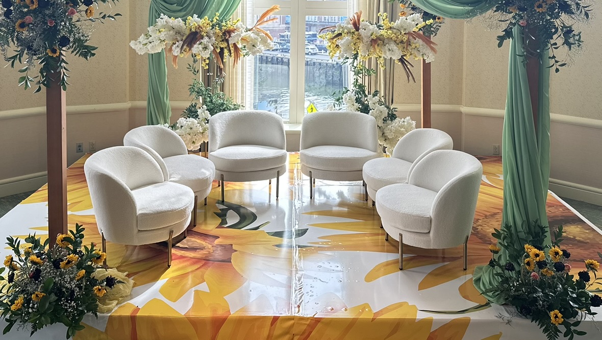 Green and white décor with white chairs